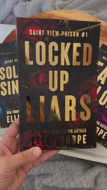 Saint View Prison — Discreet Special Edition Gold Foil Signed Paperbacks with sprayed edges.